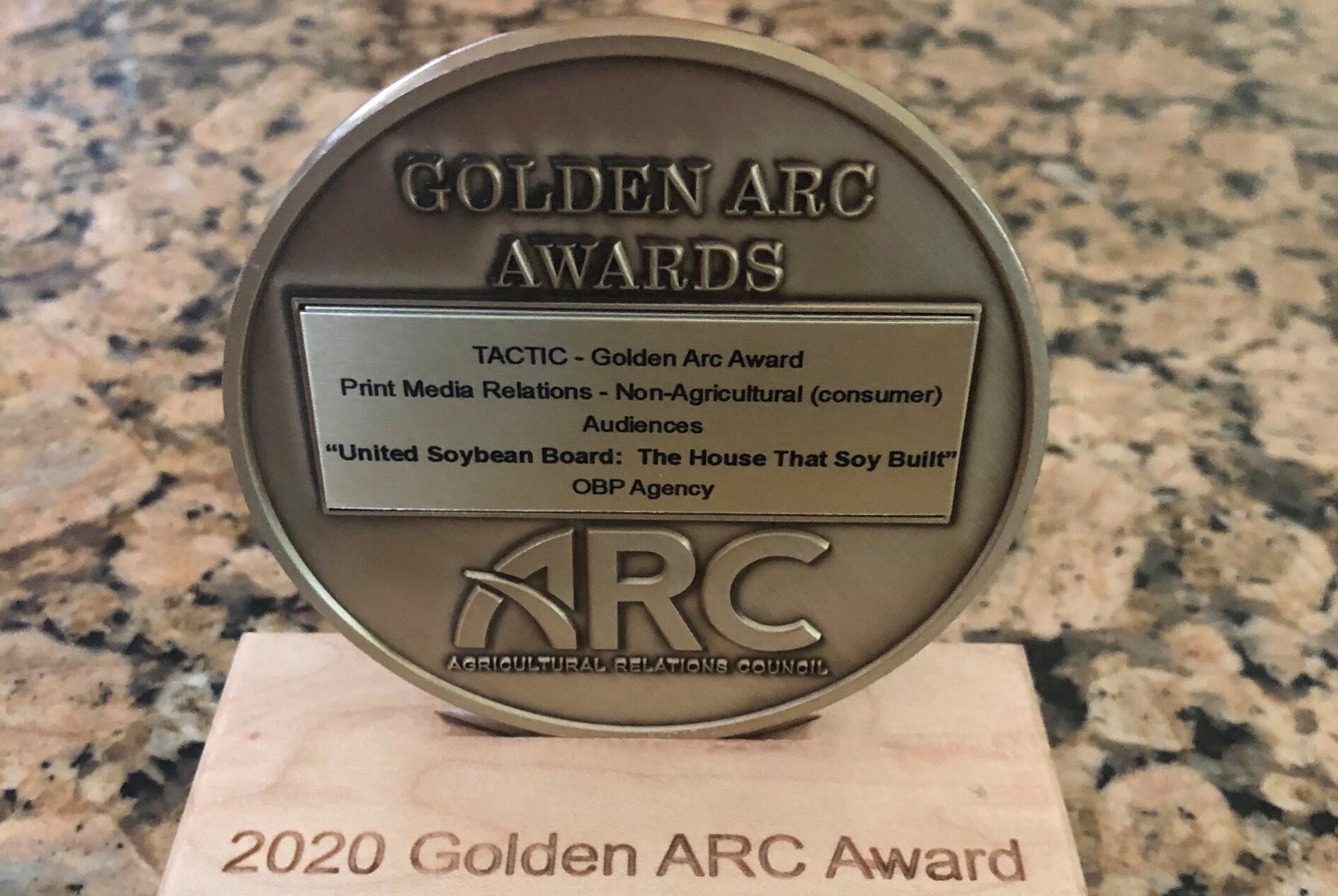A 2020 Golden ARC Award sits on a countertop.